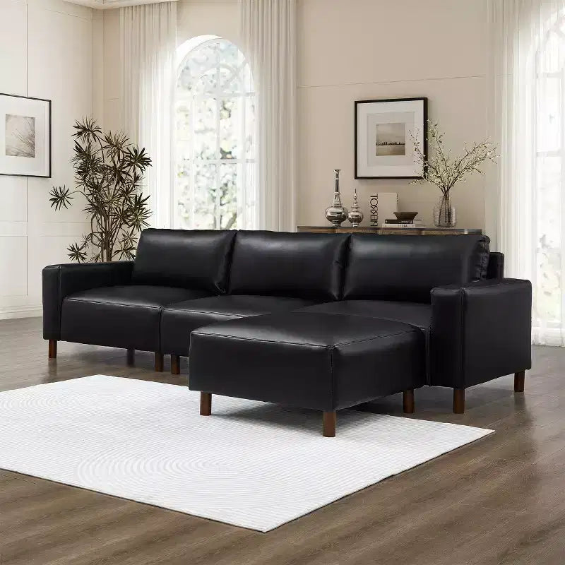 GDFStudio Arvin 112 Modernes 3-Sitzer-Sektionssofa aus Kunstleder mit Ottomane